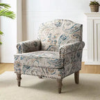 Fauteuil rembourré en bois avec motif floral, accoudoirs à panneaux et dossier en forme de bosse de chameau.