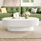 Table basse ovale avec piètement cannelé pour le salon