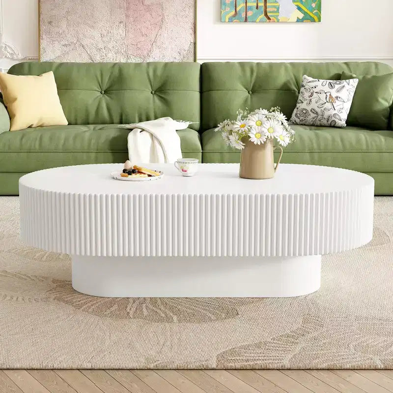 Table basse ovale avec piètement cannelé pour le salon