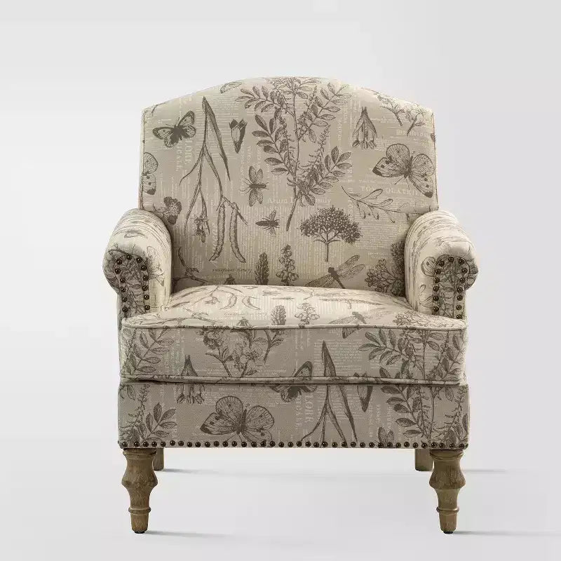 Fauteuil rembourré en bois avec motif floral, accoudoirs à panneaux et dossier en forme de bosse de chameau.